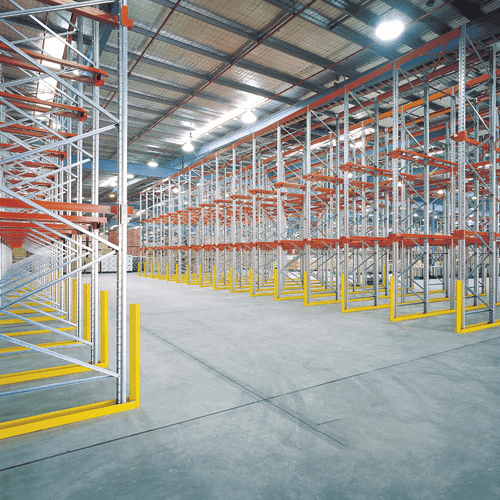 Warehouse filled with multiple bays of drive-in pallet racking.